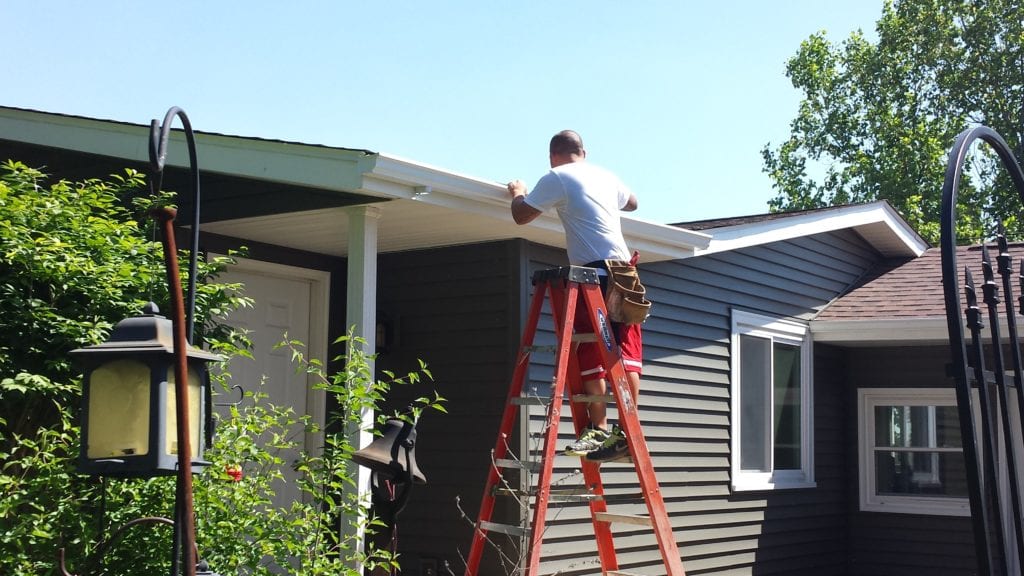 Finishing Install of New White Gutters