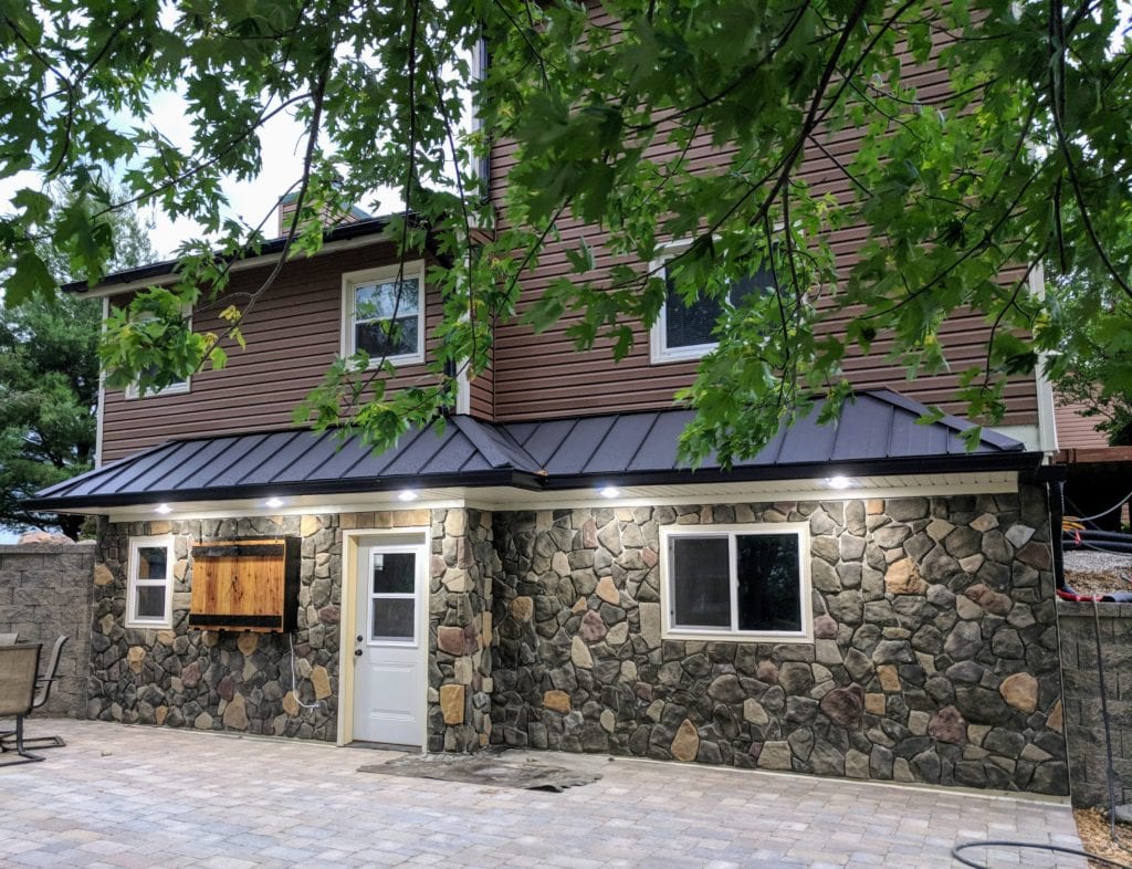 Brown Siding and Stone Work